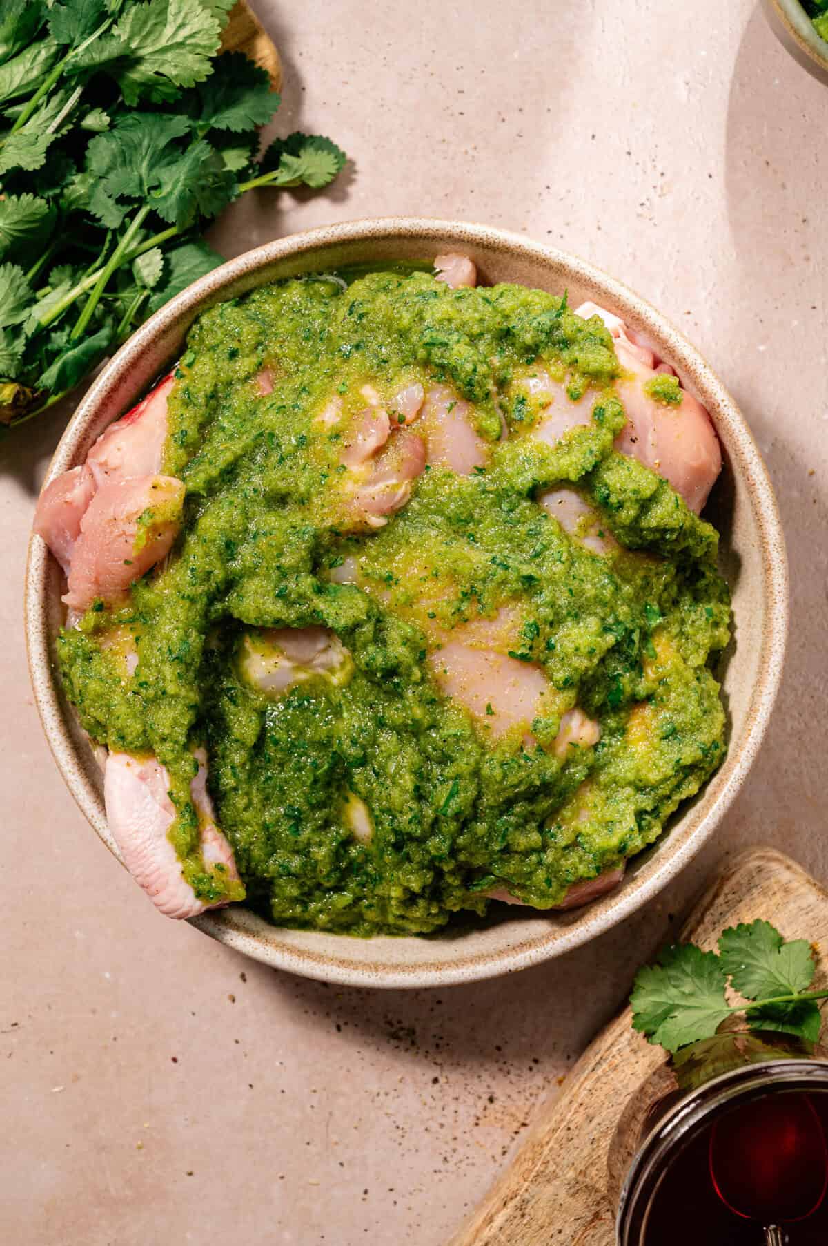 Chicken pieces marinating in homemade Ecuadorian aliño for traditional seco de pollo ecuatoriano.
